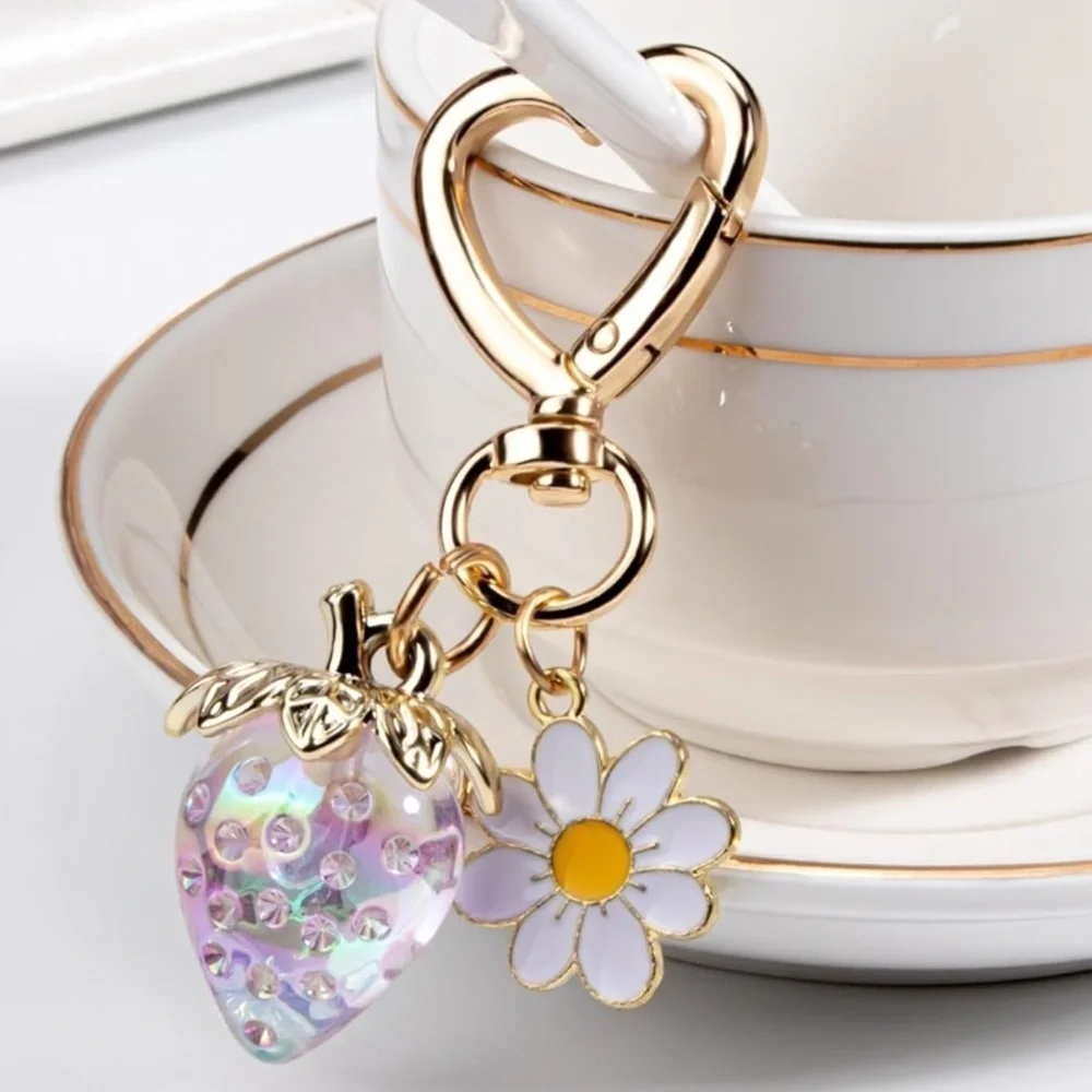 Strawberry iridescent color berry bag charm w/ white daisy and gold hear…